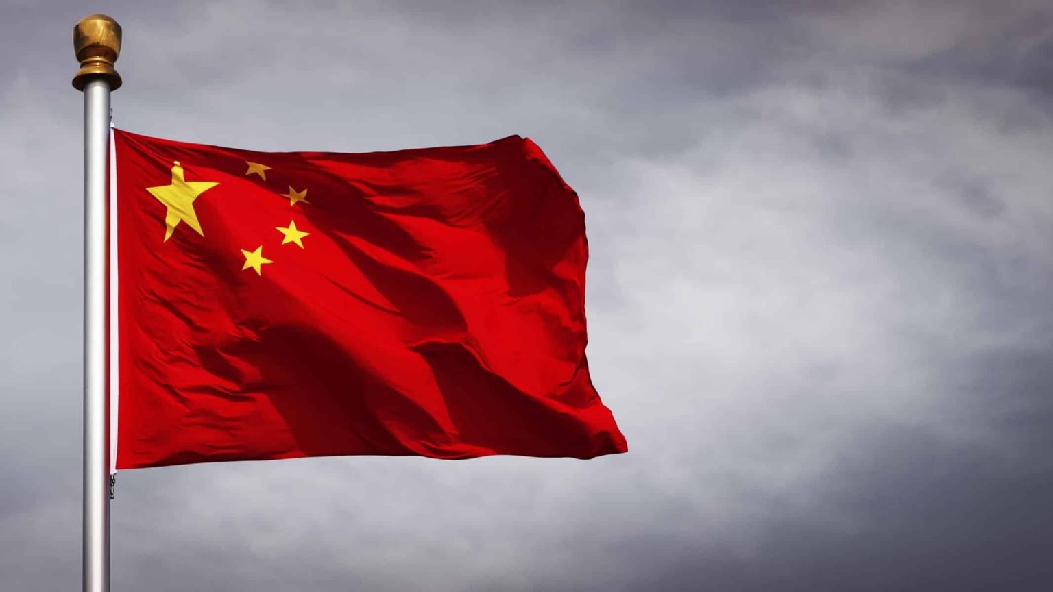 China-flag-waving-with-clouds-background-