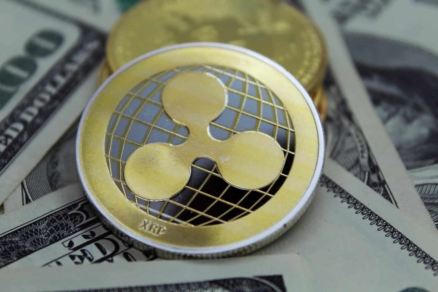 Ripple-XRP-gold-coins-over-US-dollars