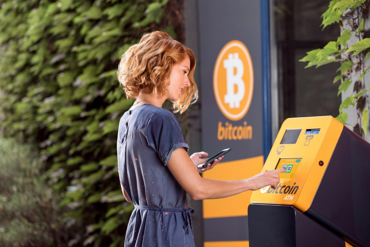 Woman-takes-Bitcoin-BTC-out-of-ATM.